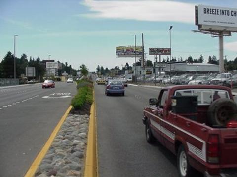 Figure 107.  When the in-service evaluation showed that many tree hits were occurring at the narrow-median locations adjacent to turn lanes, trees were no longer planted in these areas in subsequent phases of the project (SeaTac).