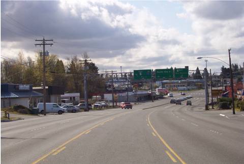 Figure 98. SR 99 before and after reconstruction in Des Moines.  The five-lane cross section with a two-way left-turn lane was common throughout the corridor (BEFORE).
