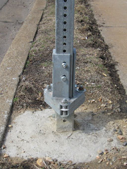 Photo of example breakaway square steel posts is shown. This is a photo of a slip coupling.