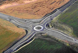 Aerial view of a roundabout intersection.