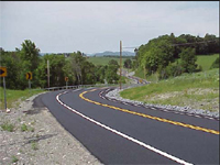 Photo. After: Road with Roadside & visibility improvements; guardrail and delineation improved