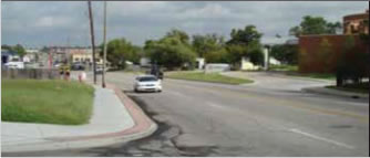 Photo: Caption: Figure 5: New Sidewalk Along Utica Avenue. 