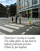 Pedestrian Crossing in London. The yellow globes on top flash to indicate pedestrian presence. (Photo by Jon Kaplan)