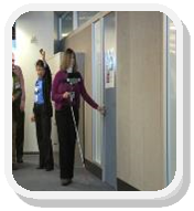Photo: Visually impaired person manuvering throught hallway