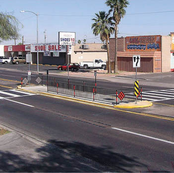 Multistage crossing area in raised median