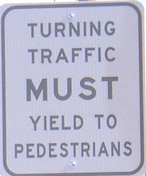 Figure 12: Turning Vehicles Yield to Pedestrians Sign