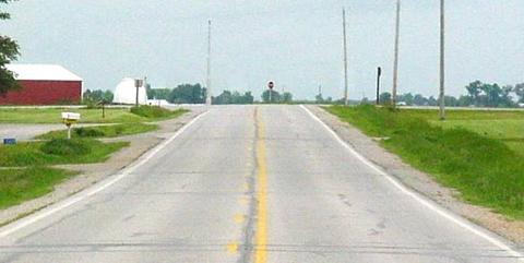 Figures 14. Before photographs of Iowa road horizontal curve improved by installing chevrons.