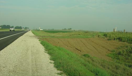 Figure 30. Photograph of farm field entrance slope flattening at an Iowa road to improve recovery area for the through road.