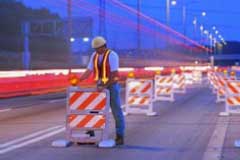 Worker in a coned off area of a work zone