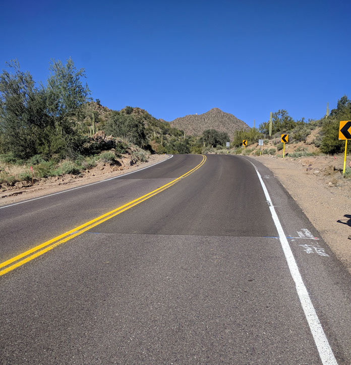 Image of rural road in Arizona showing new HFST material on roadway.