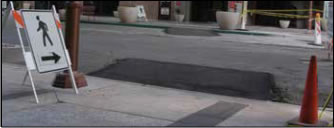 Photo: Caption: A Stable, Temporary Curb Ramp