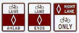 Bike lane signs should be replaced with bike lane stencils, with optional NO PARKING signs where needed. Road signs: Bike Lane Ahead, Bike Lane Ends, Bikes Only