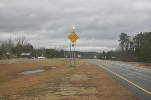 Figure 58.  Intersection warning sign with flashers activated by vehicles entering on the side road.
