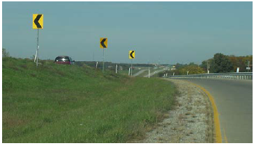 Rural roadway with chevron signs