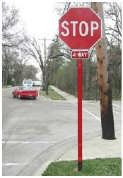 A stop sign with retroreflective strips on the sign post.