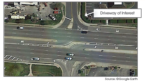 Top-down view of complex intersection with a highlighted driveway of interest.