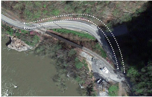 Aerial photo of the horizontal curve. A series of white dots outlines the proposed new configuration of the curve. Source: copyright 2015 Google Earth.