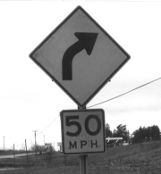 Photo of a signL Turn - 50 miles per hour
