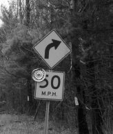 Photo of a sign: Turn - 50 miles per hour