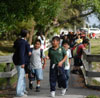 Photo.  Photo of a children walking on a path that is separated from the roadway.