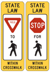 Graphic.  Signage, also known as Pedestrian Knockdown Signs, that is placed in the roadway alerting roadway users of pedestrian crossings.