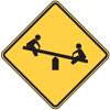 Graphic.  Yellow and black warning signs.  The top sign warns motorists of a playground; school property, buildings, or crossing guards; and/or a designated school zone.
