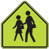 Graphic.  Yellow and black warning signs.   The bottom sign warns motorists of a school crossing. 