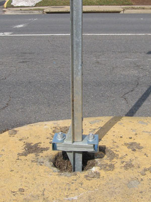 Photo and diagram. The photo depicts a breakaway treatment for a u-channel post.