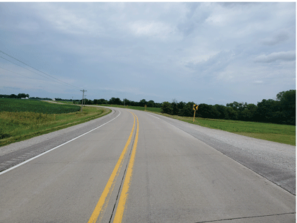 This is a photo of a two-lane road with a double center line.