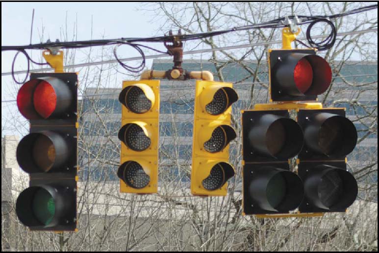 Photo of four stop lights, two red