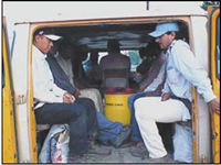 Photo of labor workers in van