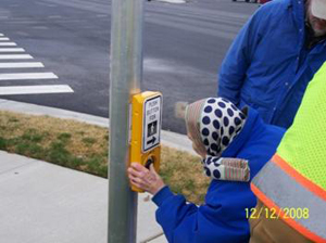 Image: Woman using the HAWK pedestrian hybrid traffic signal