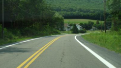 Two-lane rural roadway featuring six-inch edge lines.