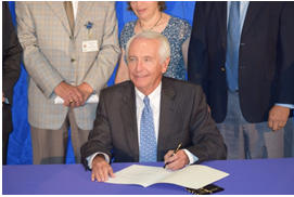 Governor Steve Beshear signing booster seat legislation into law.