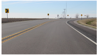 A rural curve with multiple low-cost roadway departure countermeasures applied.