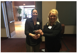 Kelly Morton (left) receives Spike award from FRA certified technical trainer Alisa Paton (right).