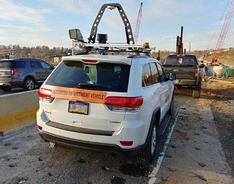 Back of the vehicle shows a device on the top.