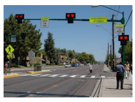 This photo depicts a pedestrian hybrid beacon at a midblock crossing.