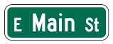 Figure 18. An image of a street name (MUTCD D3-1) sign that reads 'E Main St'.