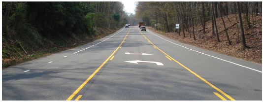 Figure 59. A picture of a highway section that has been converted into one travel lane in each direction with a center two-way left-turn lane.
