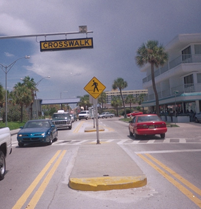 Figure 11. A picture of a raised median island with yellow surfacing on the vertical curb and the top of the nose of the island.