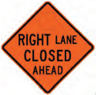 Figure 67. An image of an orange work zone sign with the message 'RIGHT LANE CLOSED AHEAD' in black letters.  The words 'RIGHT' and 'CLOSED' have a larger letter height than the other words.