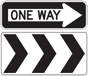 Figure 81. An image of a 'ONE WAY' sign above a Roundabout Direction Arrow (R6-4a) sign