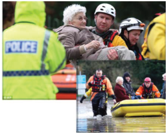 Image shows emergency personnel evacuating seniors during a flood