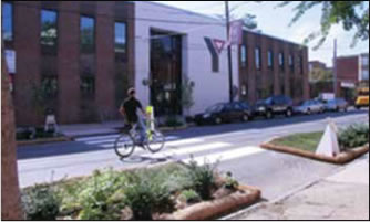 Photo: Caption: Figure 9: Temporary Road Diet and Crosswalk Created for the Better Blocks Philly Event.