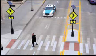 Photo: A bright, irregularly flashing beacon that is placed at crosswalks without stop signs or traffic signals.