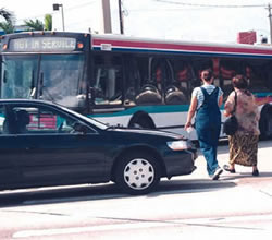 Pedestrians are crossing outside of a crosswalk to reach a bus stop. Observation studies can identify potential safey problems such as this that may not be apparent through an analysis of reported crashes.