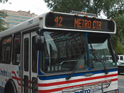 Safety innovations, such as the strobe lights shown above the destination display on this WMATA bus, can increase the visibility of buses and improve the safety of pedestrians as they access transit.