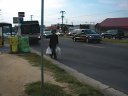 This shelter is not connected to a sidewalk system, so pedestrians must either travel in the road or grass to get to the bus stop. This is especially problematic for wheelchair users.