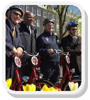 Photo: Secretary Fox and others posing with Smart City Bicycles